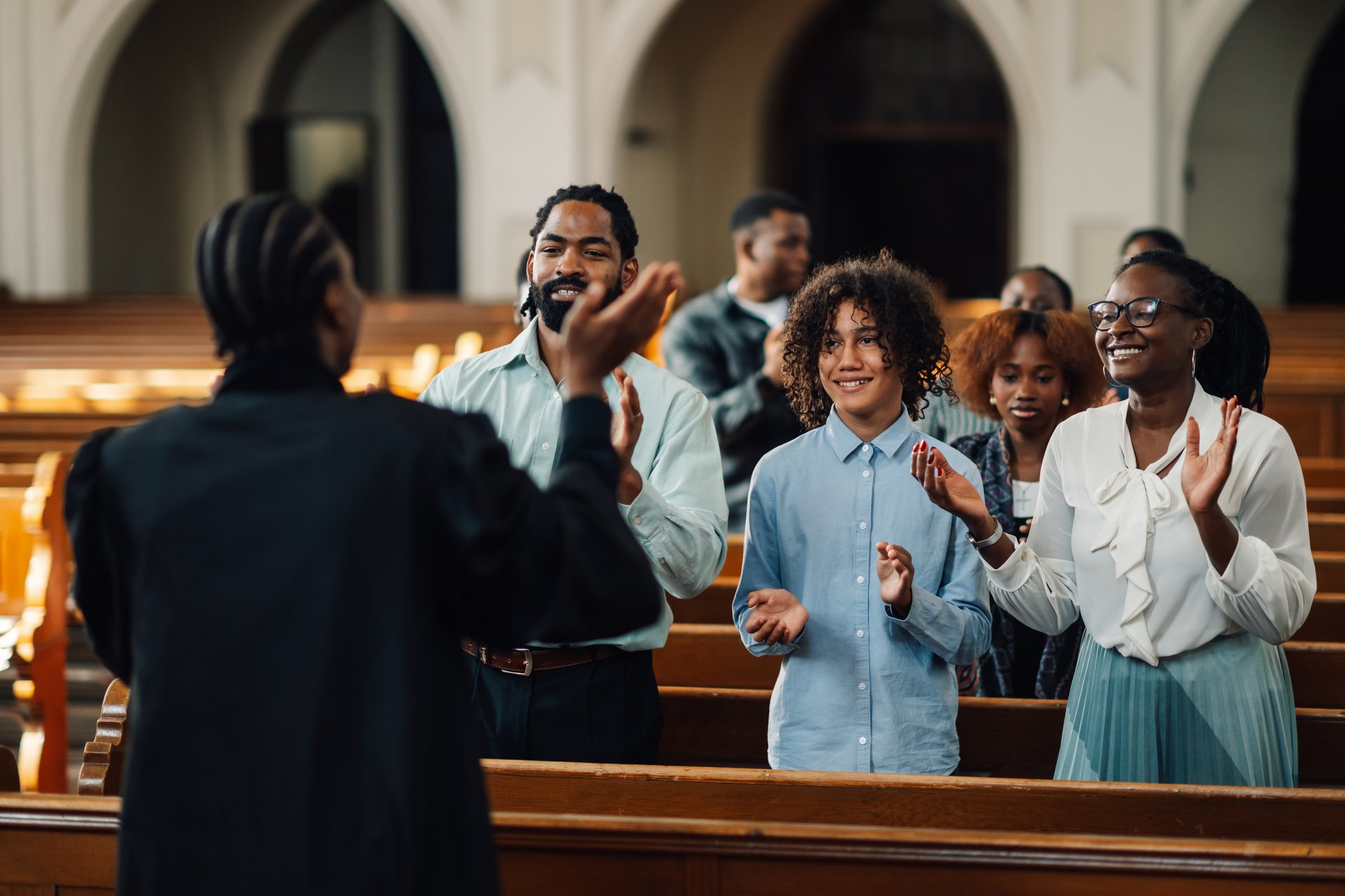 Congregation worshiping together in church